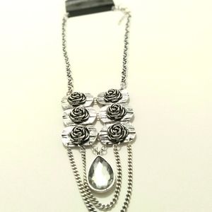 Silver tone chain style rose and crystal statement necklace